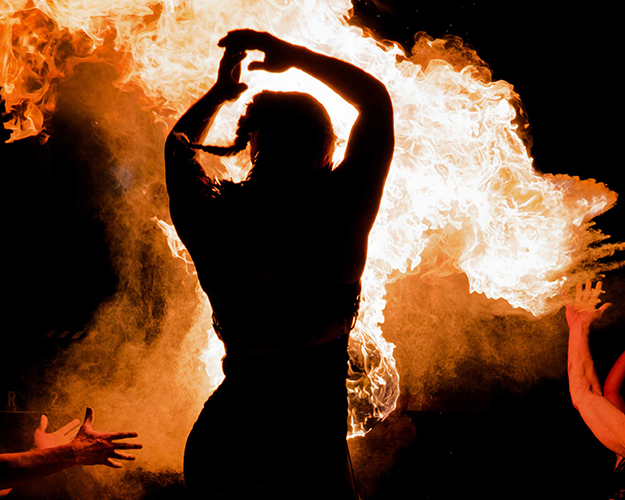 Performer Felicity Boyd of Motus Collective. Fire performance at UNSEEN Winter Solstice Fire Festival 2023, event by Dragon Mill, Light Square, Adelaide, photo by Bill J Pearce