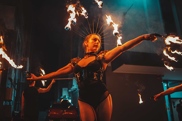Performer Felicity Boyd of Motus Collective. Performing with Fire Crown and Fire Fingers.  Fire performance at UNSEEN Winter Solstice Fire Festival 2023, event by Dragon Mill, Light Square, Adelaide, photo by Castleforge Photography